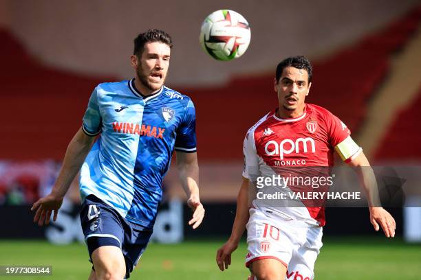 Monaco's French forward Wissam Ben Yedder fights for the ball with Le Havre's French defender Gautier Lloris during the French L1 football match...