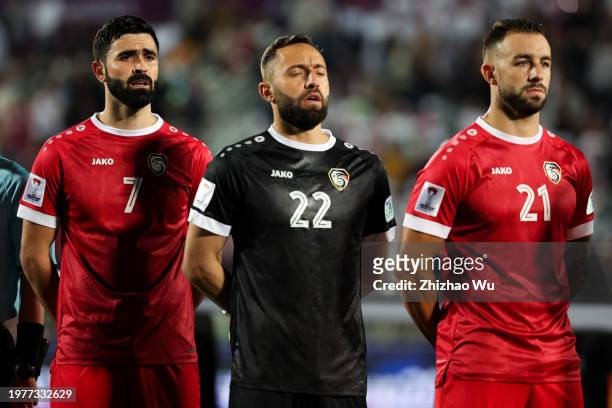 Omar Khrbin, Ahmad Madanieh, Ibrahim Hesar of Syria look on during the AFC Asian Cup Round of 16 match between Iran and Syria at Abdullah Bin Khalifa...