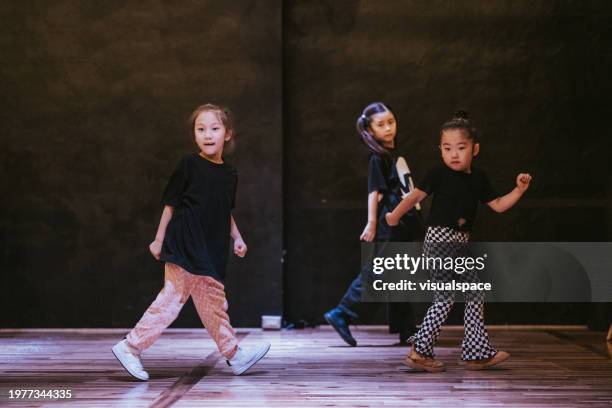 japanese girls engage in breakdance session - just dance 3 stock pictures, royalty-free photos & images