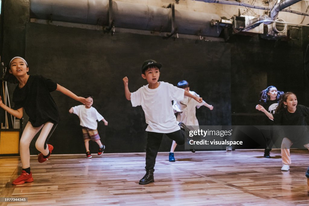 Japanese kids immersed in the rhythm and flow of a hip-hop breakdance class