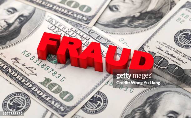 fraud text with financial background - blanqueo de dinero fotografías e imágenes de stock