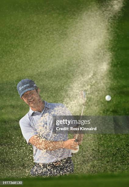 Jorge Campillo of Spain plays his fourth shot from a bunker on the 14th hole during Day One of the Bahrain Championship presented by Bapco Energies...