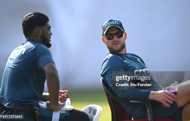 England bowler Rehan Ahmed speaks to head coach Brendon McCullum during England practice ahead of the second test match at ACA-VDCA Stadium on...