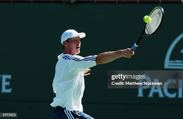 Marat Safin of Russia returns a shot to Stefan Koubek of Austria during the Pacific Life Open at the Indian Wells Tennis Garden on March 10, 2003 in...