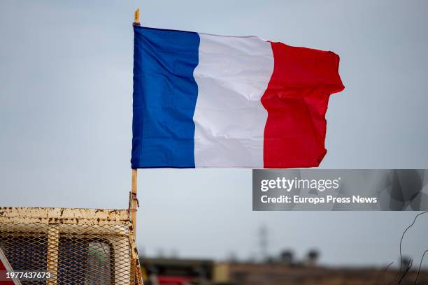 French flag on a French farmers' tractor during the cut of the French A-9 in the vicinity of the border with Spain, February 1 in Le Boulou . French...