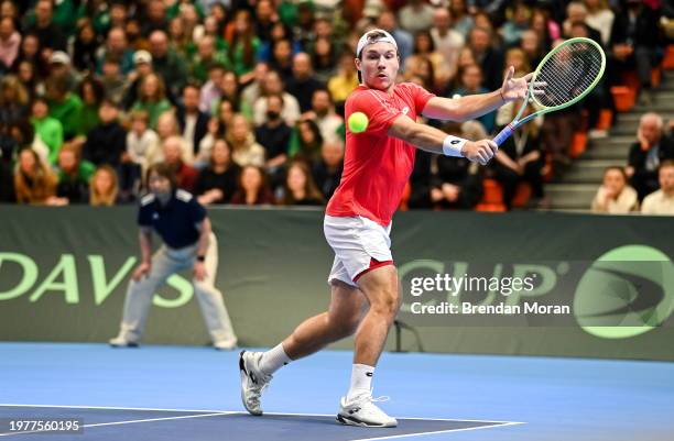 Limerick , Ireland - 4 February 2024; Lucas Miedler of Austria in action against David O'Hare and Conor Gannon of Ireland during his doubles match on...