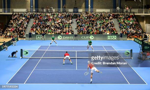 Limerick , Ireland - 4 February 2024; Lucas Miedler of Austria serves to David O'Hare of Ireland during their doubles match on day two of the Davis...