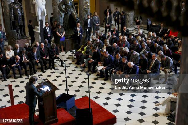 President Joe Biden and others bow their heads in prayer led by the House chaplain Margaret G. Kibben during the annual National Prayer Breakfast in...