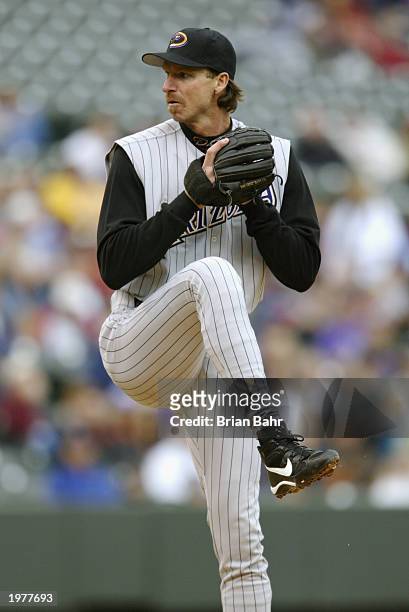 Starting pitcher Randy Johnson of the Arizona Diamondbacks delivers a pitch during the game against the Colorado Rockies at Coors Field on April 5,...