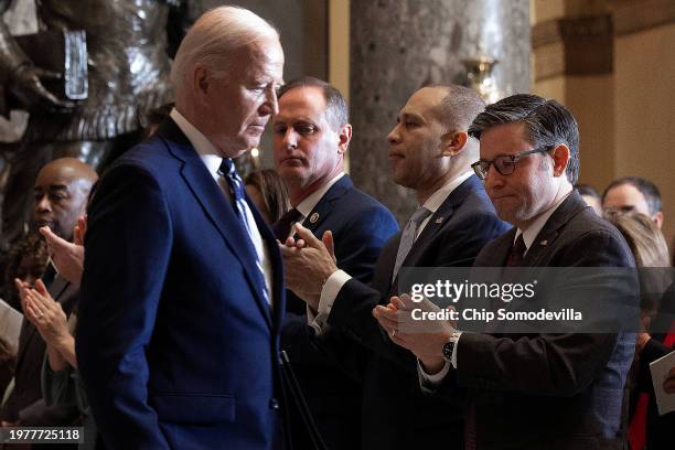 Speaker of the House Mike Johnson , House Minority Leader Hakeem Jeffries and others applaud for U.S. President Joe Biden following his remarks...