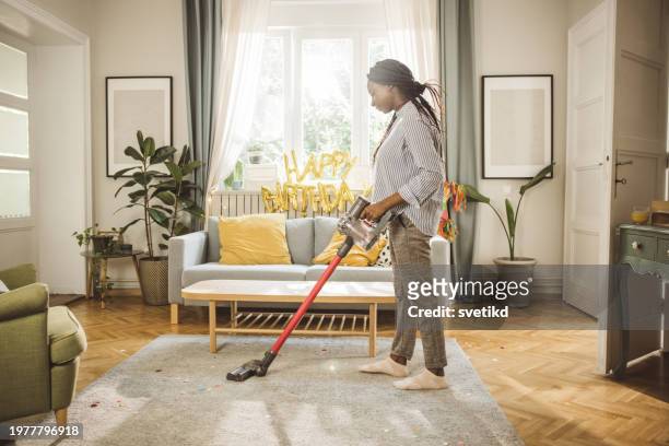 after party cleaning - vacuum cleaner woman stock pictures, royalty-free photos & images