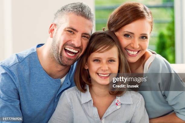 teenage girl with mother and father - smiling people human teeth stock pictures, royalty-free photos & images