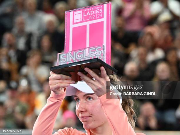 Second placed Russia's Ekaterina Alexandrova poses with her trophy after the final match against Latvia's Jelena Ostapenko during the WTA Upper...