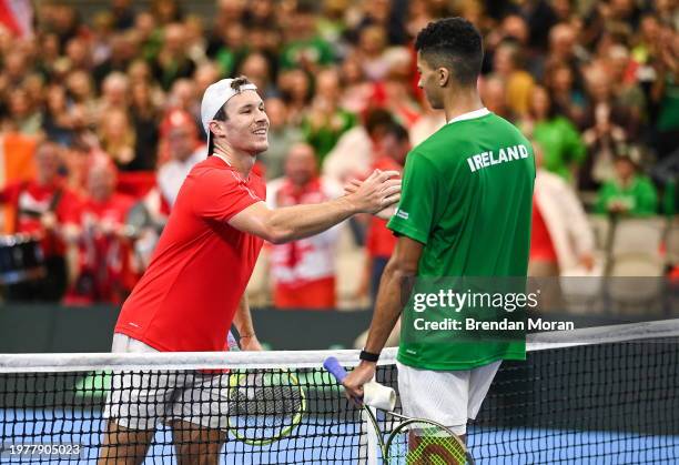 Limerick , Ireland - 4 February 2024; Lucas Miedler of Austria, left, and Michael Agwi of Ireland after their singles match on day two of the Davis...