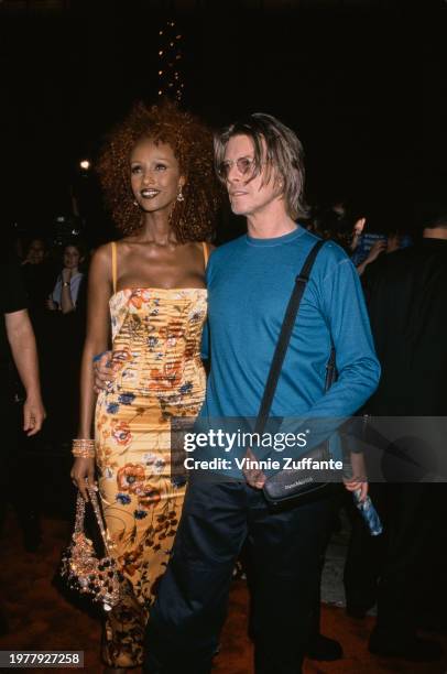 Somali-American fashion model Iman and British singer-songwriter and musician David Bowie at the 1999 MTV Music Video Awards held at the Metropolitan...