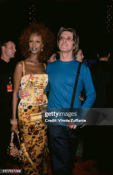 Somali-American fashion model Iman and British singer-songwriter and musician David Bowie at the 1999 MTV Music Video Awards held at the Metropolitan...