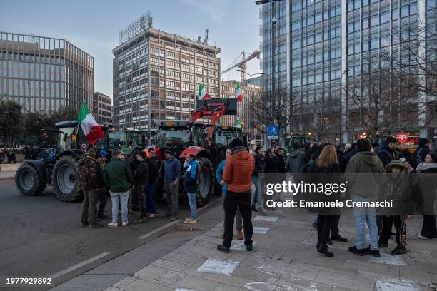 Farmers gather after having parked their tractors in front of Milan Central railway station and Grattacielo Pirelli, one of Region Lombardy's HQ, on...