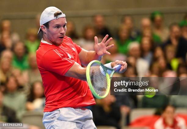 Limerick , Ireland - 4 February 2024; Lucas Miedler of Austria in action against Michael Agwi of Ireland during their singles match on day two of the...