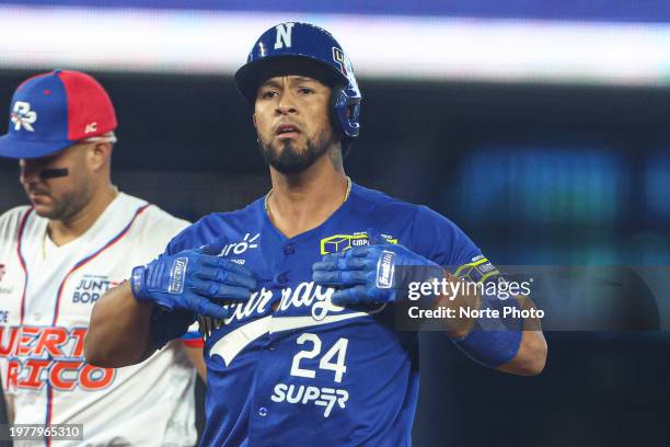 Cheslor Cuthbert of Gigantes de Rivas of Nicaragua celebrates a run-scoring double in the second inning during a game between Nicaragua and Puerto...