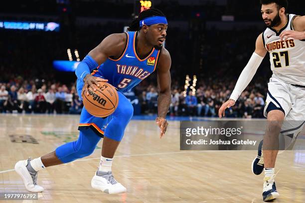 Luguentz Dort of the Oklahoma City Thunder handles the ball during the first half against the Denver Nuggets at Paycom Center on January 31, 2024 in...