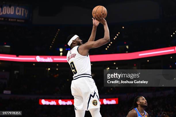Justin Holiday of the Denver Nuggets goes up for a shot during the second half against the Oklahoma City Thunder at Paycom Center on January 31, 2024...