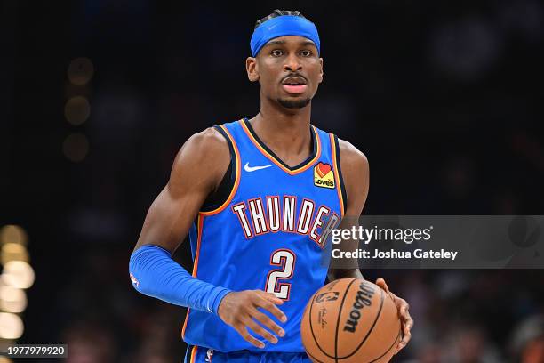 Shai Gilgeous-Alexander of the Oklahoma City Thunder handles the ball during the first half against the Denver Nuggets at Paycom Center on January...