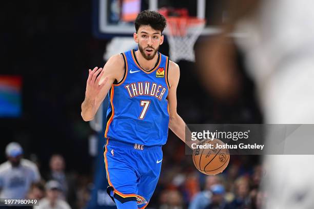 Chet Holmgren of the Oklahoma City Thunder handles the ball during the first half against the Denver Nuggets at Paycom Center on January 31, 2024 in...