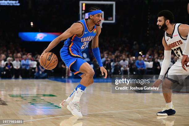 Aaron Wiggins of the Oklahoma City Thunder handles the ball during the first half against the Denver Nuggets at Paycom Center on January 31, 2024 in...