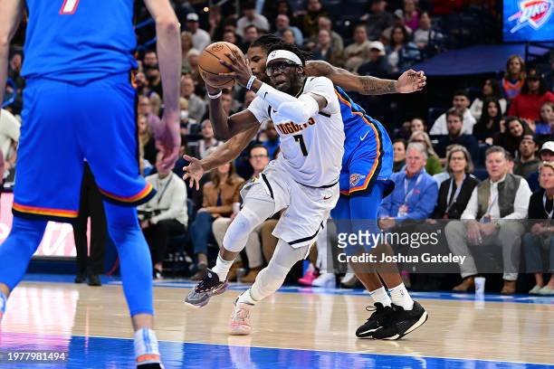Reggie Jackson of the Denver Nuggets drives the lane during the second half against the Oklahoma City Thunder at Paycom Center on January 31, 2024 in...