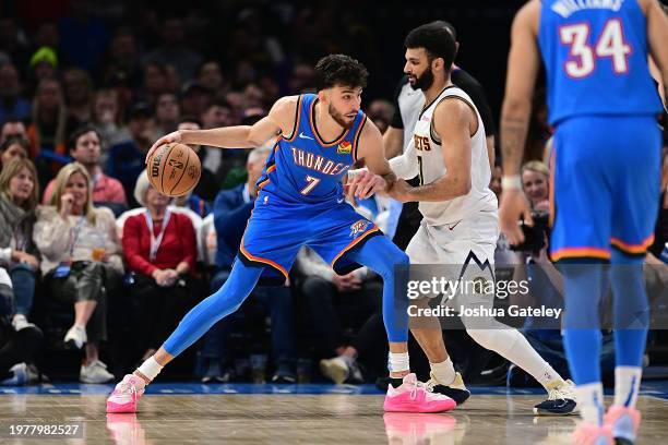 Chet Holmgren of the Oklahoma City Thunder looks to back down Jamal Murray of the Denver Nuggets during the second half at Paycom Center on January...