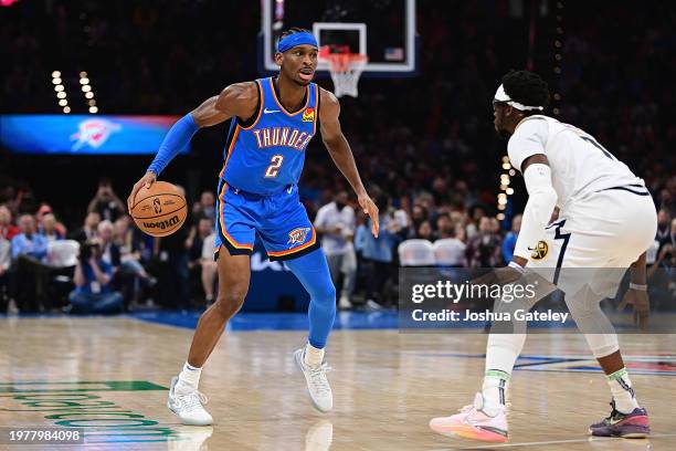 Shai Gilgeous-Alexander of the Oklahoma City Thunder looks to drive during the first half against the Denver Nuggets at Paycom Center on January 31,...