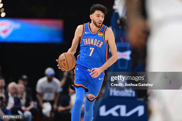 Chet Holmgren of the Oklahoma City Thunder handles the ball during the first half against the Denver Nuggets at Paycom Center on January 31, 2024 in...