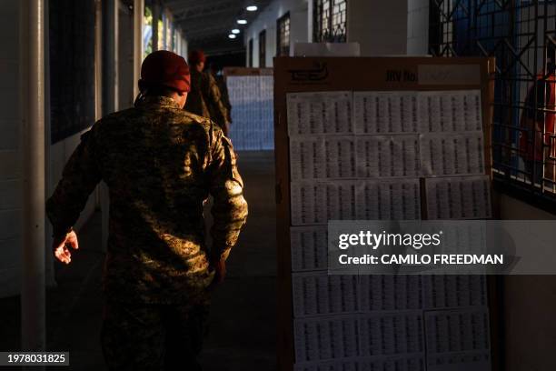 Soldier lines up to vote during the presidential and legislative elections at a polling station in the La Campanera neighborhood in Soyapango, El...