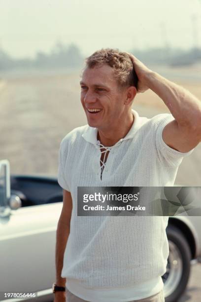 Actor and driving enthusiast Steve McQueen gets ready to put some sportscars through their paces at the Riverside Raceway in June, 1966 in Riverside,...