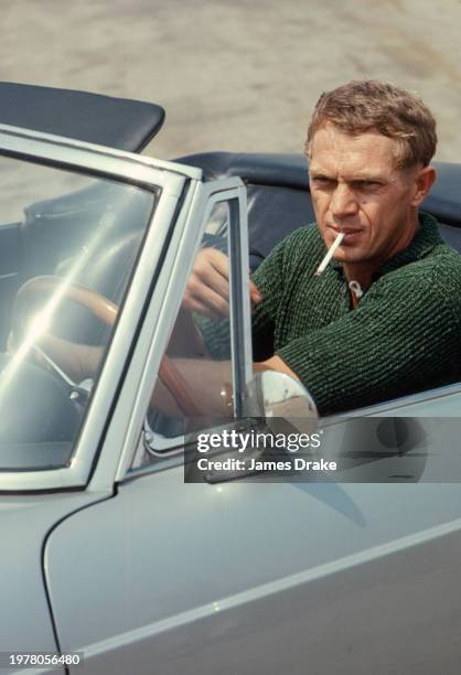 Actor and driving enthusiast Steve McQueen gets ready to put a Ferrari 275 GTS convertible through its paces at the Riverside Raceway in June, 1966...