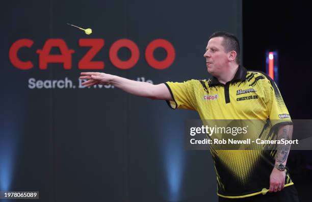 Dave Chisnall throws during his PDC 2024 Cazoo Masters Quarter-Final match against Michael van Gerwen at Marshall Arena on February 4, 2024 in Milton...