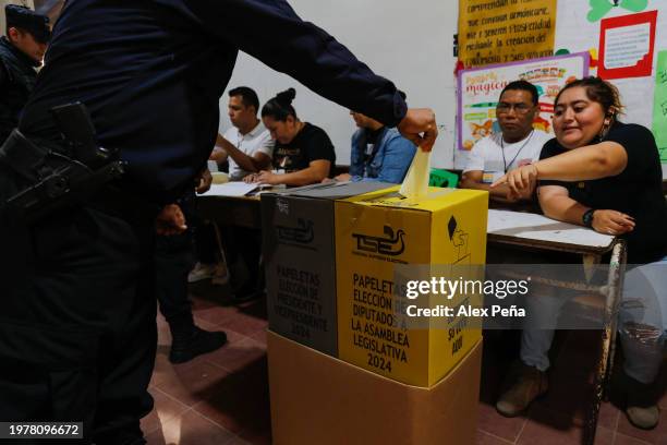 Police officer casts his vote in Panchimalco during El Salvador's presidential and legislative elections on February 4, 2024 in San Salvador, El...