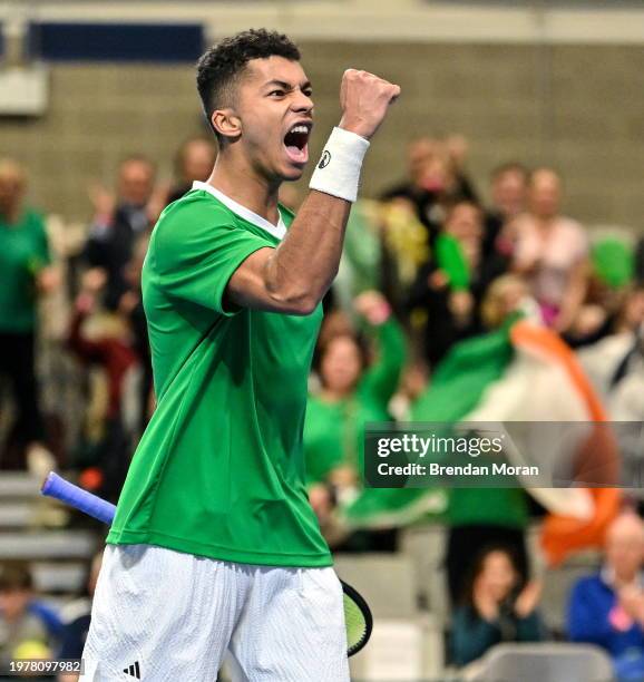 Limerick , Ireland - 4 February 2024; Michael Agwi of Ireland celebrates winning a point against Lucas Miedler of Austria during their singles match...