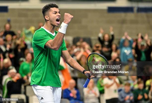 Limerick , Ireland - 4 February 2024; Michael Agwi of Ireland celebrates winning a point against Lucas Miedler of Austria during their singles match...