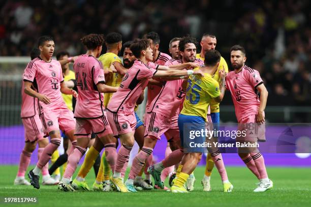 The players of Al-Nassr and Inter Miami clash during the Riyadh Season Cup match between Al-Nassr and Inter Miami at Kingdom Arena on February 01,...