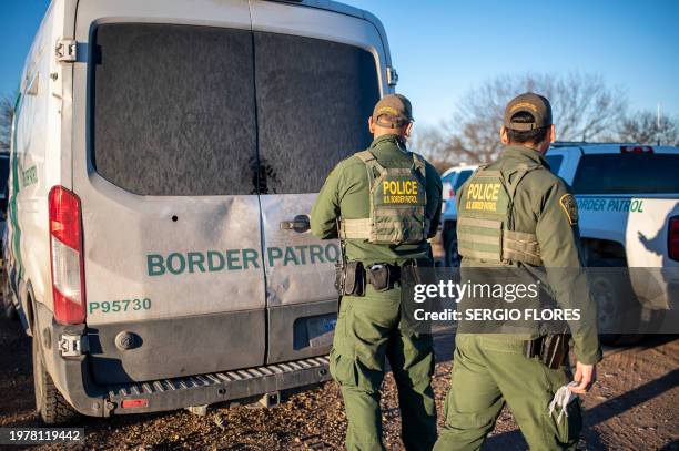 Border Patrol processes a group of about 60 migrants near the highway on February 4, 2024 outside Eagle Pass, Texas. Eagle Pass, about 20 miles from...