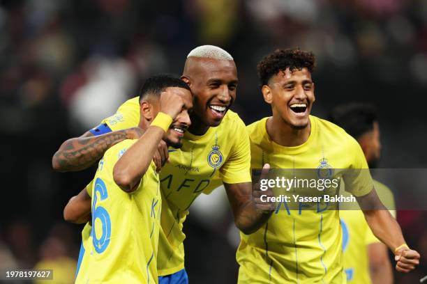 Anderson Talisca of Al-Nassr celebrates with Abdulaziz Al Elewai and Mohammed Maran of Al-Nassr after scoring his team's fourth goal during the...