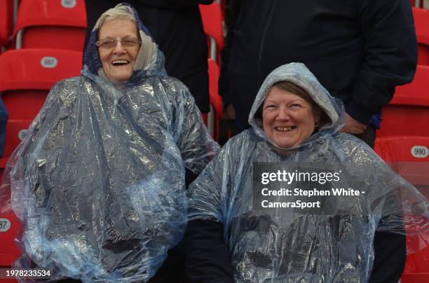 Two Leicester City fans enjoy their teams 5-0 victory in the rain during the Sky Bet Championship match between Stoke City and Leicester City at...