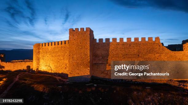 illuminated castle wall at dusk - fortified wall stock pictures, royalty-free photos & images