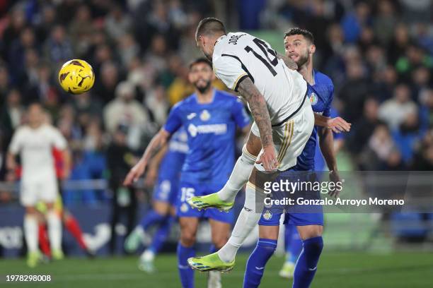 Joselu Mato of Real Madrid CF scores their opening goal during the LaLiga EA Sports match between Getafe CF and Real Madrid CF at Coliseum Alfonso...