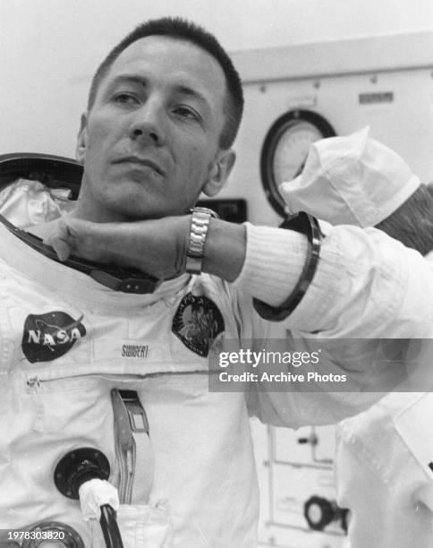 Astronaut John L. Swigert Jr., command module pilot for the Apollo 13 mission suits up at the Kennedy Space Center's Manned Spacecraft Operations...