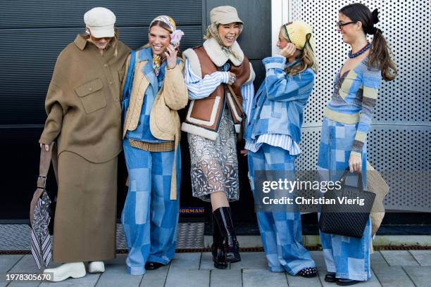 Amalie Nielsen wears grey baker boy hat, brown jacket, skirt & Rita Montezuma wears head scarf, beige quilted jacket, denim jacket, wide leg pants,...