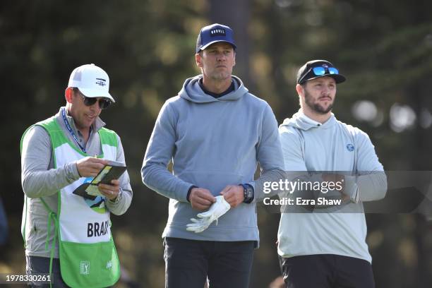 Former NFL quarterback Tom Brady, center, and Josh Allen of the NFL Buffalo Bills, right, look on during the first round of the AT&T Pebble Beach...