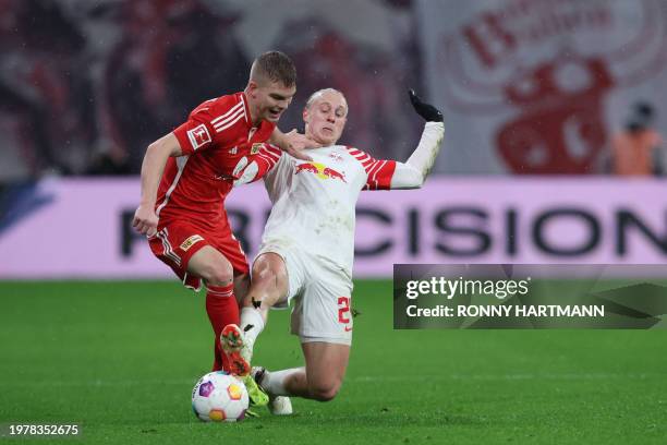 Union Berlin's Hungarian midfielder Andras Schaefer and Leipzig's Austrian midfielder Xaver Schlager vie for the ball during the German first...