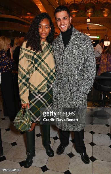 Cheyenne Maya-Carty aka Chey Maya and Ashton Gohil attend the opening of the Burberry takeover of Harrods on February 1, 2024 in London, England.